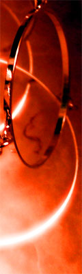 This is a fragment of Mindy's silvery hooped necklace. I made it glow and shifted it to red artificially.