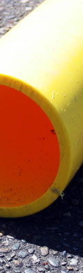 This is a big yellow pipe that was on the ground somewhere. It looked cool, because the sun left the inside of it with a deep orange color.