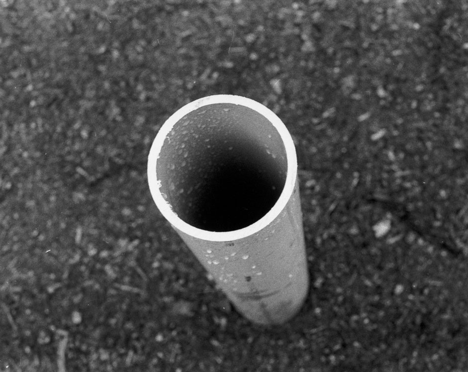 Looking down a random pipe sticking out of the ground at my highschool