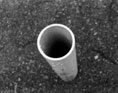 Looking down a random pipe sticking out of the ground at my highschool
